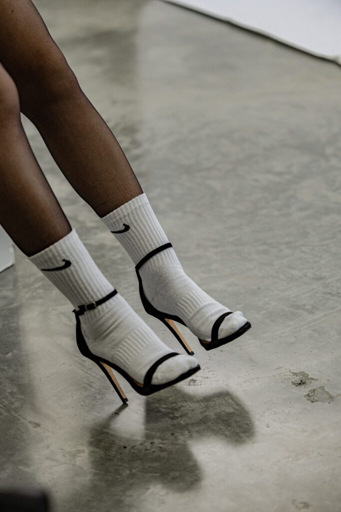woman wearing nike socks with heals